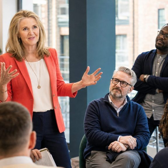 Kate Cook leading a practical workplace wellbeing session for a UK corporate team